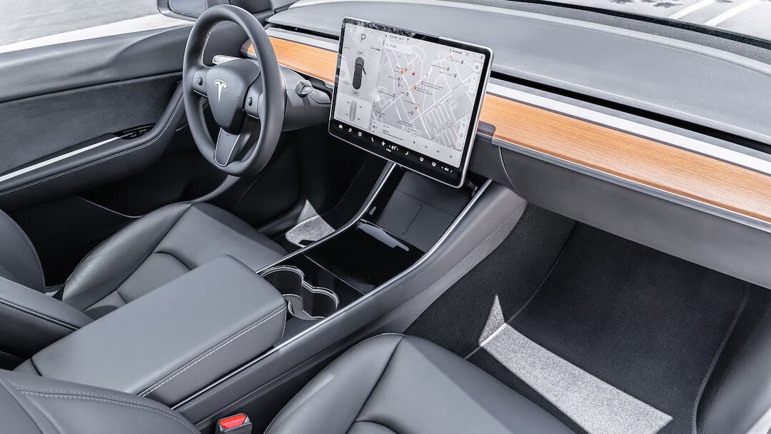 Tesla Model Y Performance (2020-2025) interior photo, front seat, driver seat, dashboard, steering wheel, infotainment, cockpit