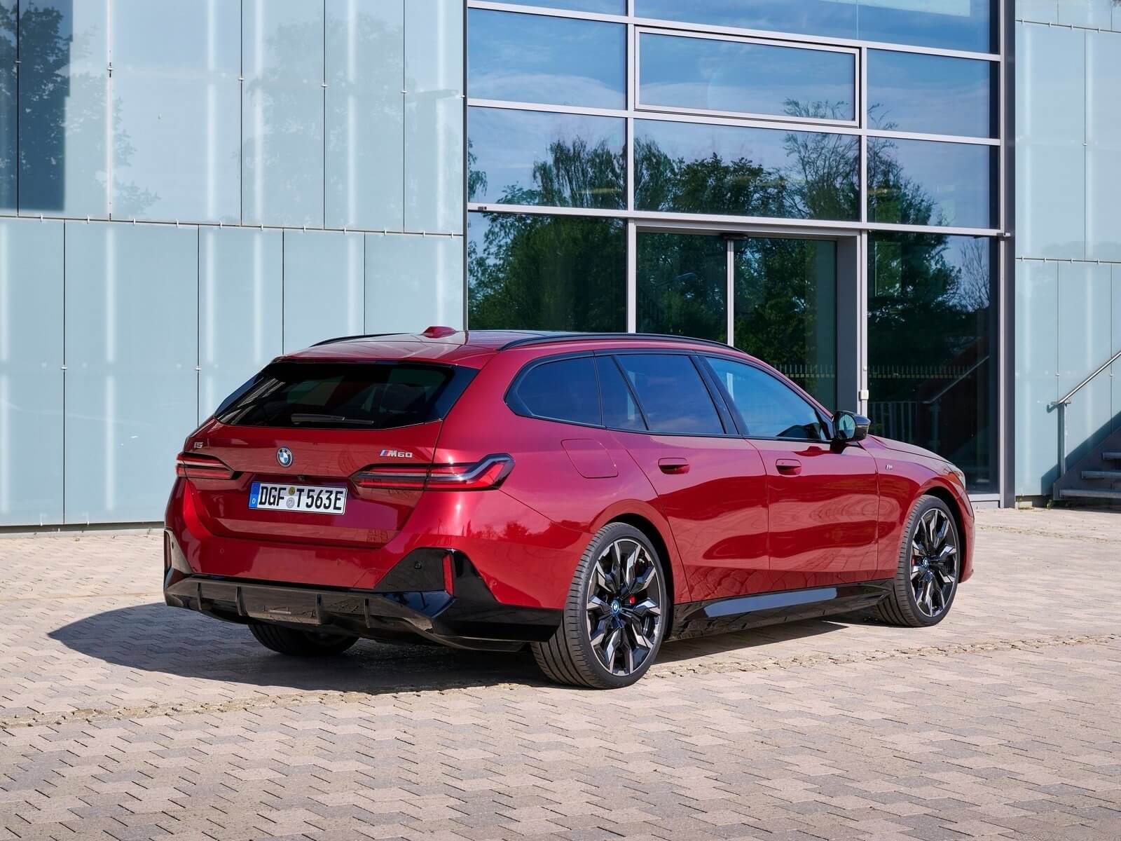 Interior of the 2026 BMW i5 Touring showing curved dual screens and premium materials