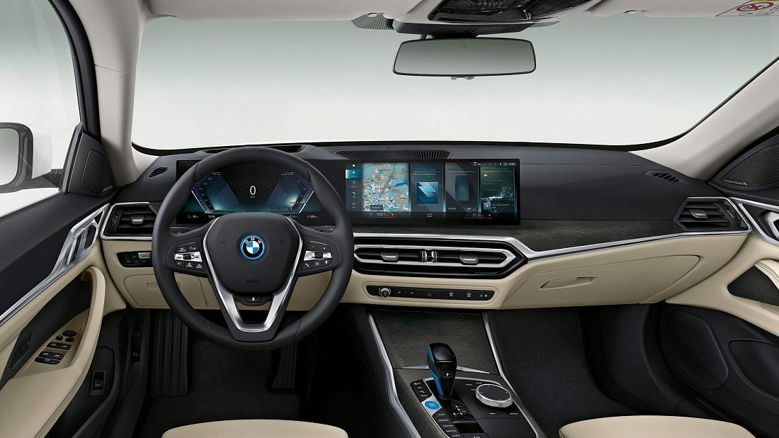 BMW i4 eDrive40 (2021-2024) interior photo, front seat, driver seat, dashboard, steering wheel, infotainment, cockpit