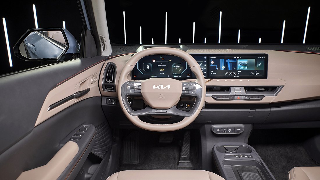 Kia EV5 Long Range FWD (2026-…) interior photo, front seat, driver seat, dashboard, steering wheel, infotainment, cockpit