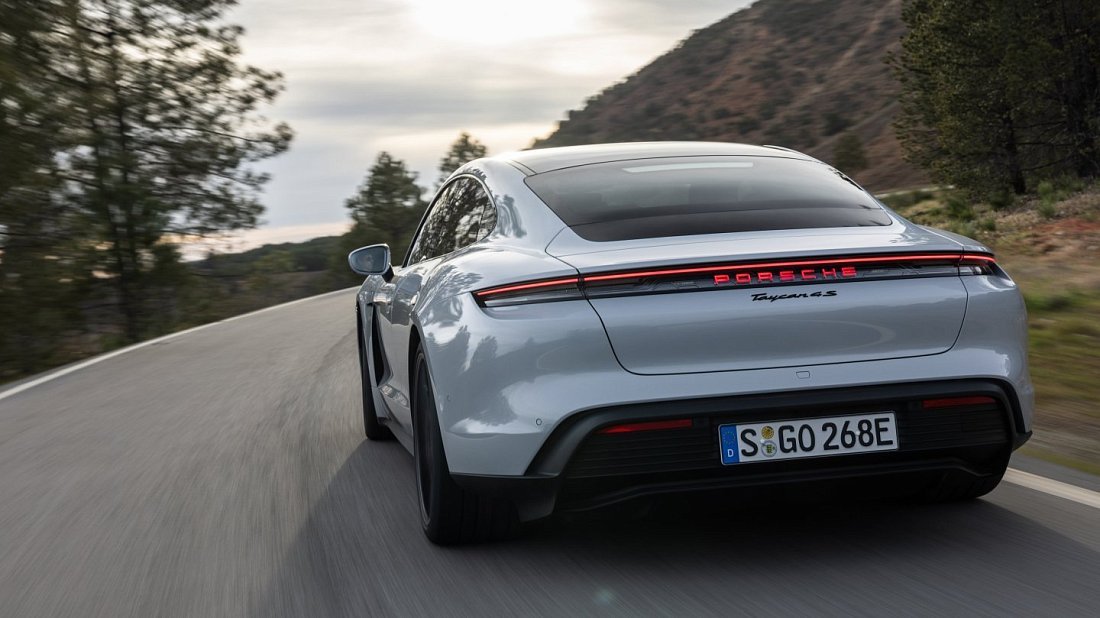 Porsche Taycan RWD Plus (2024-…) rear view, taillights, trunk, spoiler, badge, bumper, exterior
