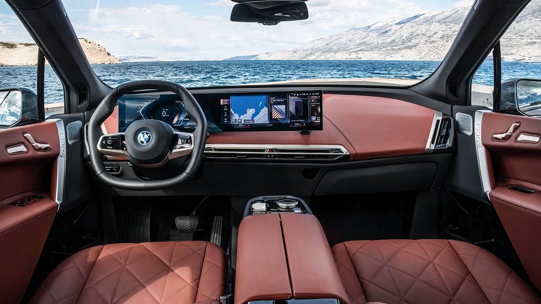 BMW iX xDrive50 (2021-2025) interior, front seat, driver seat, dashboard, steering wheel, infotainment, cockpit