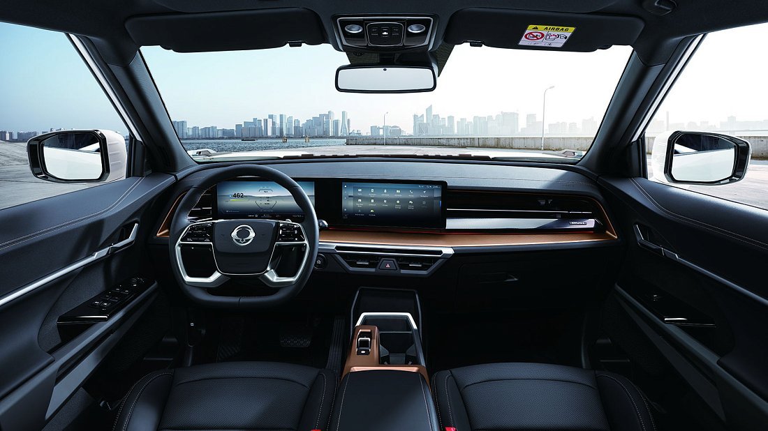 KGM Torres EVX (2024-...) interior photo, front seat, driver seat, dashboard, steering wheel, infotainment, cockpit