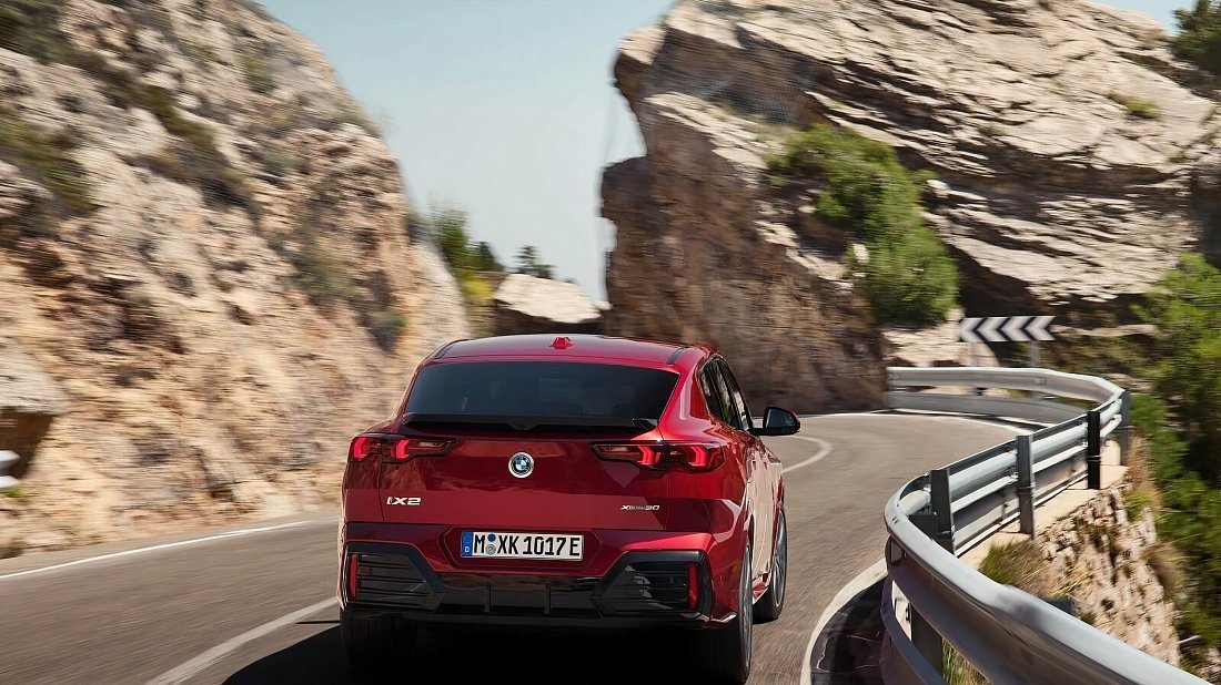 BMW iX2 eDrive20 (2024-…) rear view, taillights, trunk, spoiler, badge, bumper, exterior