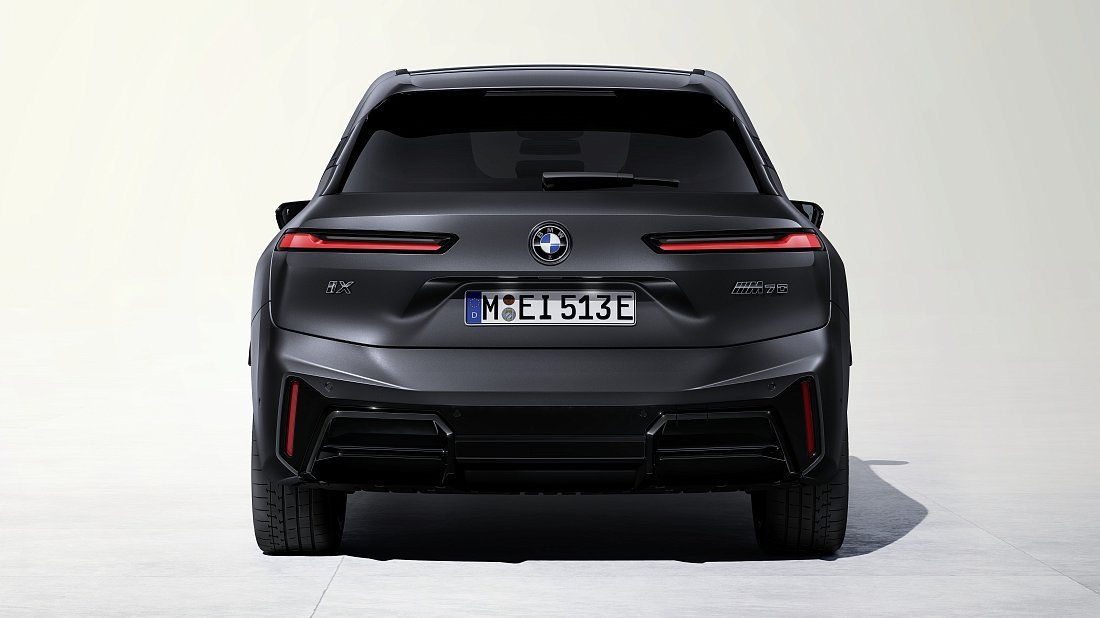 BMW iX M70 xDrive (2025-...) rear view, taillights, trunk, spoiler, badge, bumper, exterior
