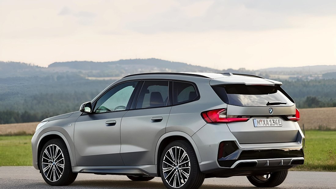 BMW iX1 eDrive20 (2023-…) rear quarter, three-quarter view, diagonal, exterior