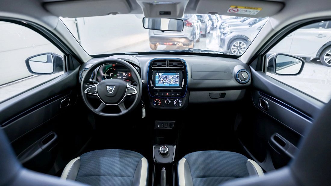Dacia Spring Electric (2021-2022) interior photo, front seat, driver seat, dashboard, steering wheel, infotainment, cockpit