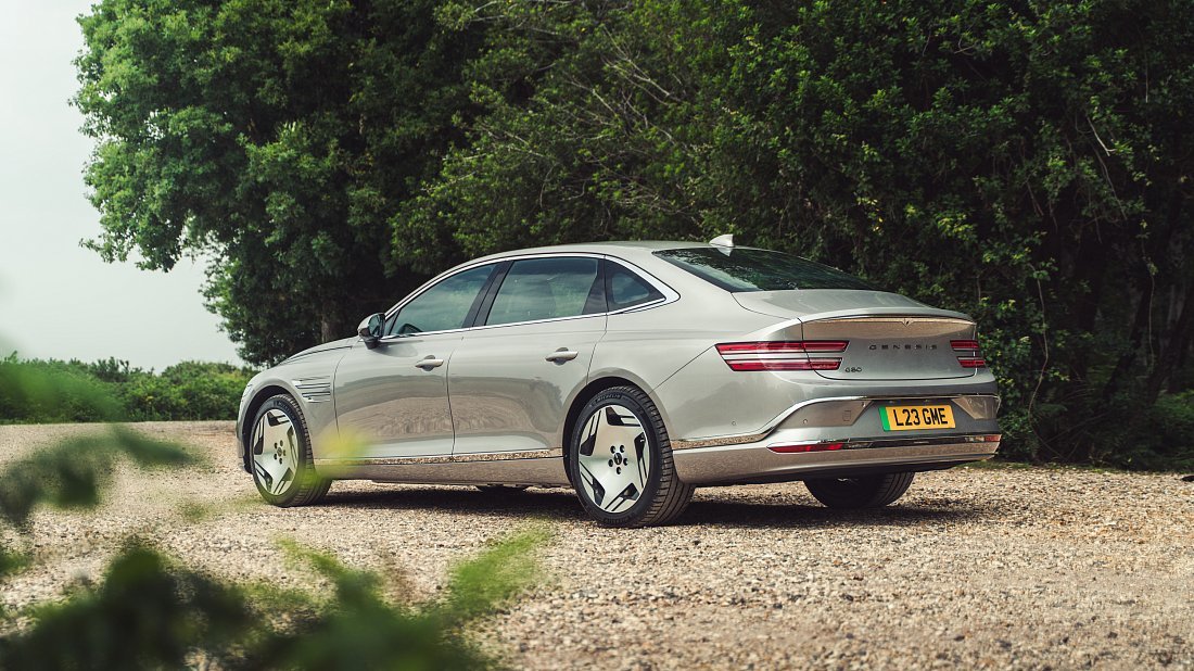 Genesis Electrified G80 AWD (2025-…) rear quarter photo, three-quarter view, diagonal, exterior