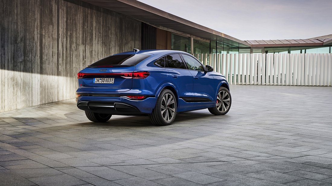 Audi SQ6 Sportback e-tron (2025-…) rear quarter photo, three-quarter view, diagonal, exterior