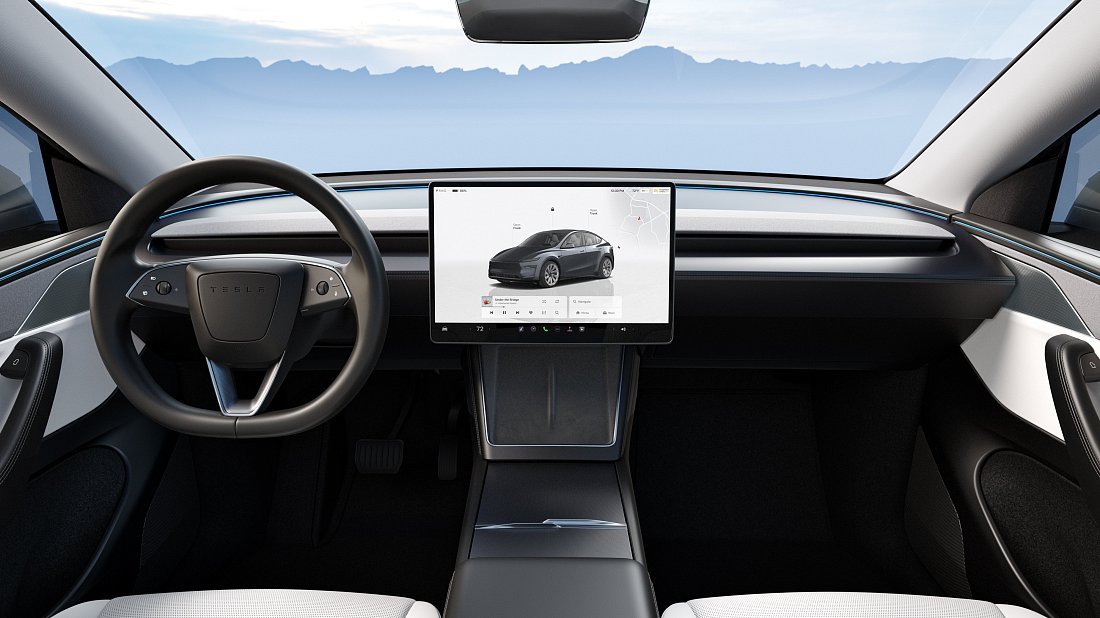 Tesla Model Y Premium RWD (2025-...) interior photo, front seat, driver seat, dashboard, steering wheel, infotainment, cockpit