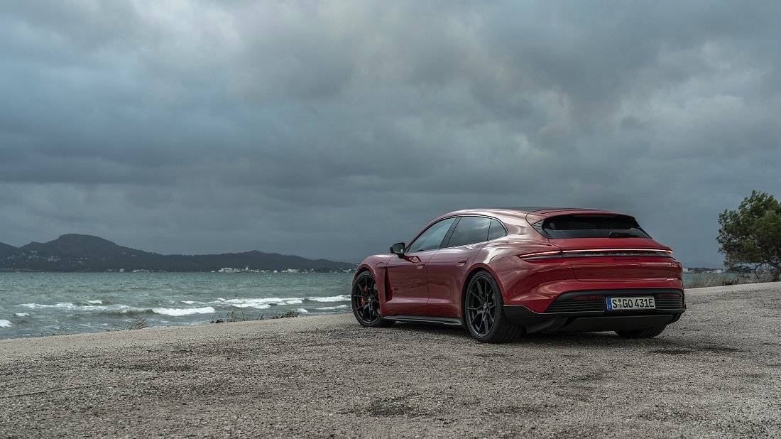 Porsche Taycan GTS Sport Turismo (2022-2024) rear quarter photo, three-quarter view, diagonal, exterior