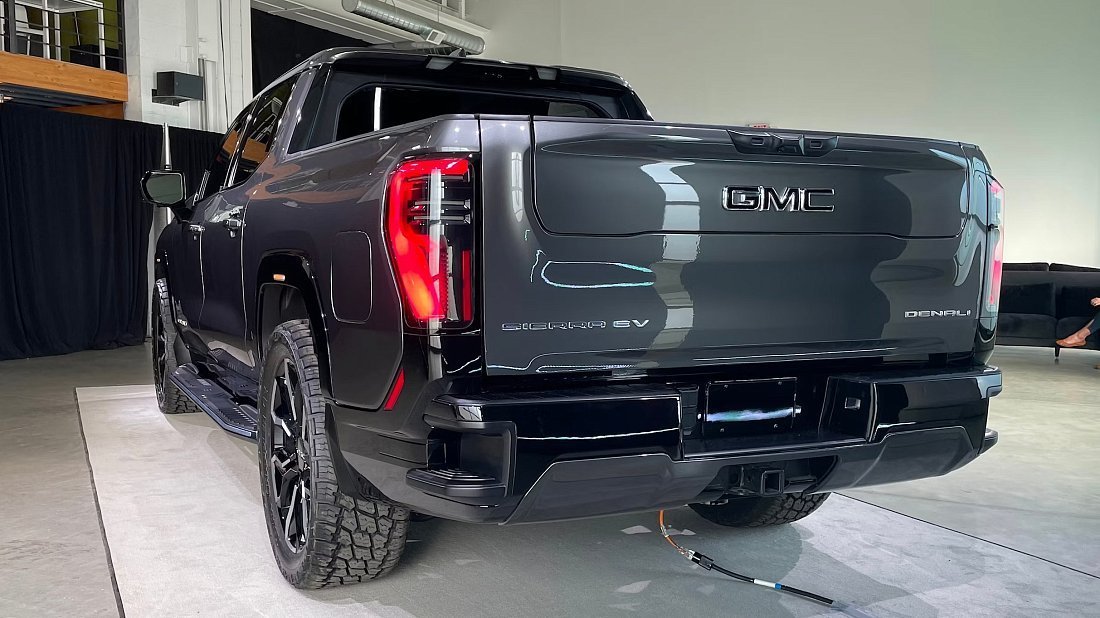 GMC Sierra EV Denali Edition 1 (2024-2025) rear view photo, taillights, trunk, spoiler, badge, bumper, exterior