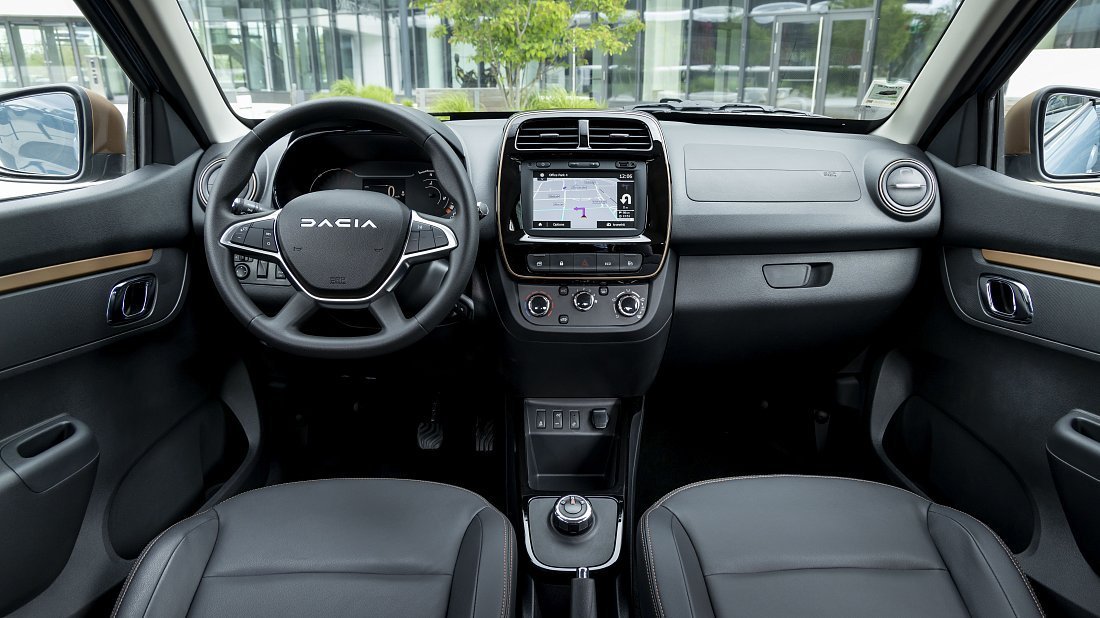 Dacia Spring Electric 65 (2023-2024) interior photo, front seat, driver seat, dashboard, steering wheel, infotainment, cockpit