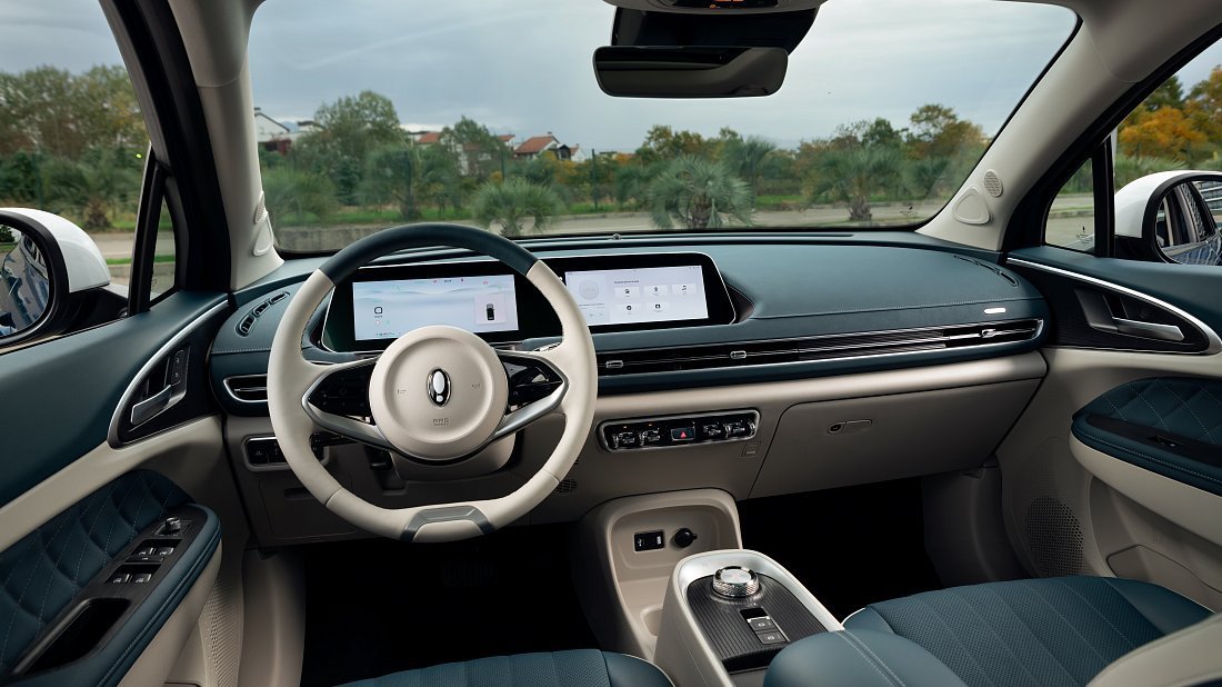 GWM ORA 03 48 kWh (2022-…) interior photo, front seat, driver seat, dashboard, steering wheel, infotainment, cockpit