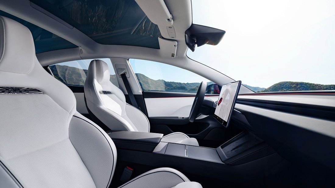 Tesla Model 3 Performance (2024-…) interior photo, front seat, driver seat, dashboard, steering wheel, infotainment, cockpit