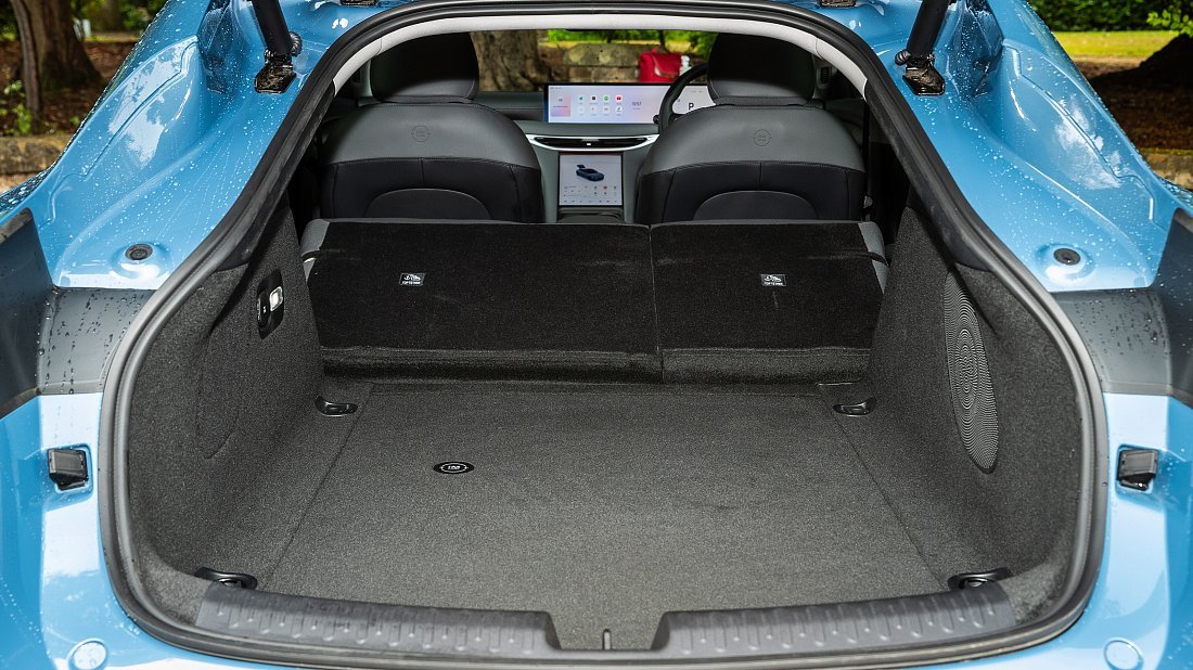 MG IM5 Performance (2025-...) folded trunk photo, boot, expanded, folded seats, maximum volume, max cargo, max capacity, max storage