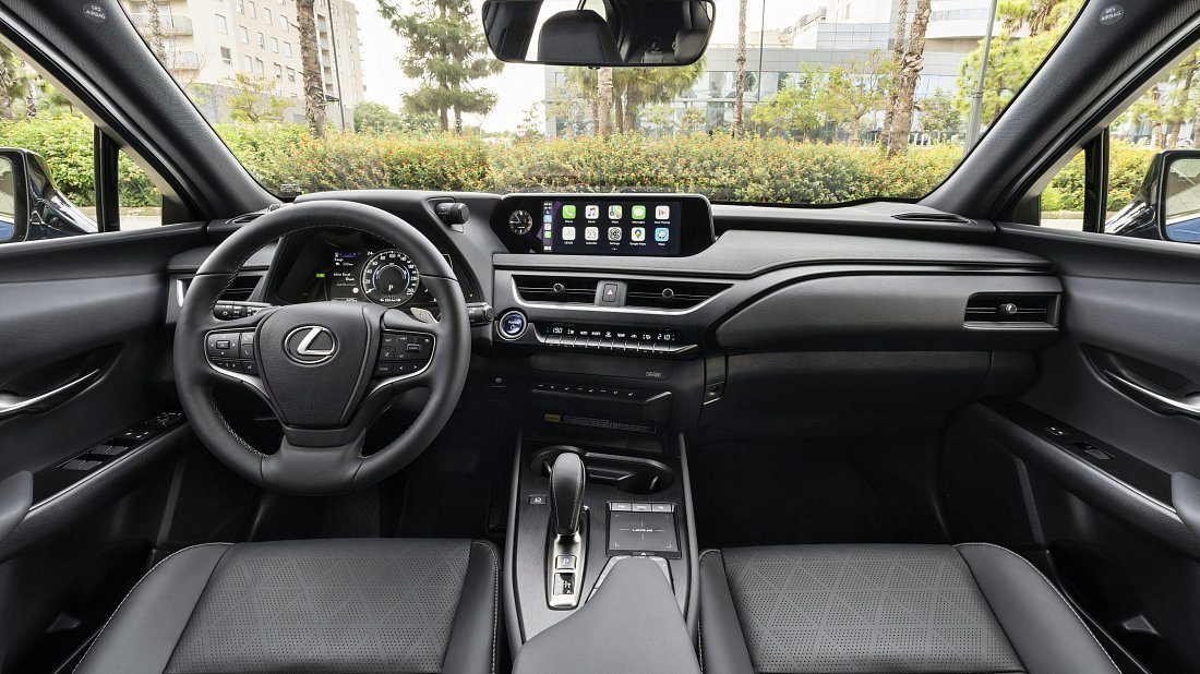 Lexus UX 300e (2023-…) interior photo, front seat, driver seat, dashboard, steering wheel, infotainment, cockpit