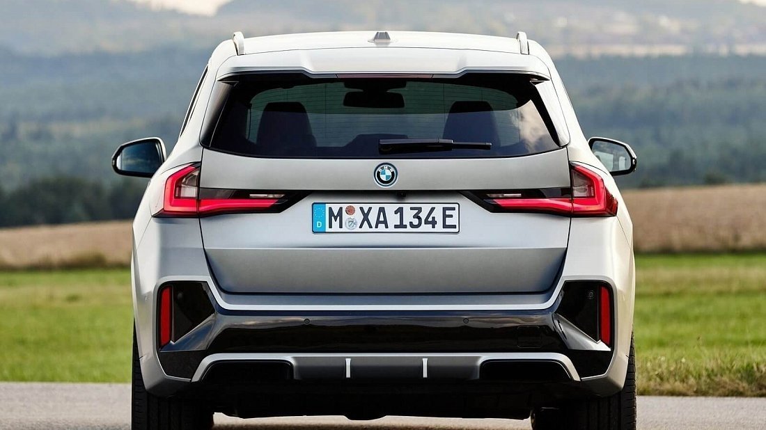 BMW iX1 xDrive30 (2022-…) rear view photo, taillights, trunk, spoiler, badge, bumper, exterior
