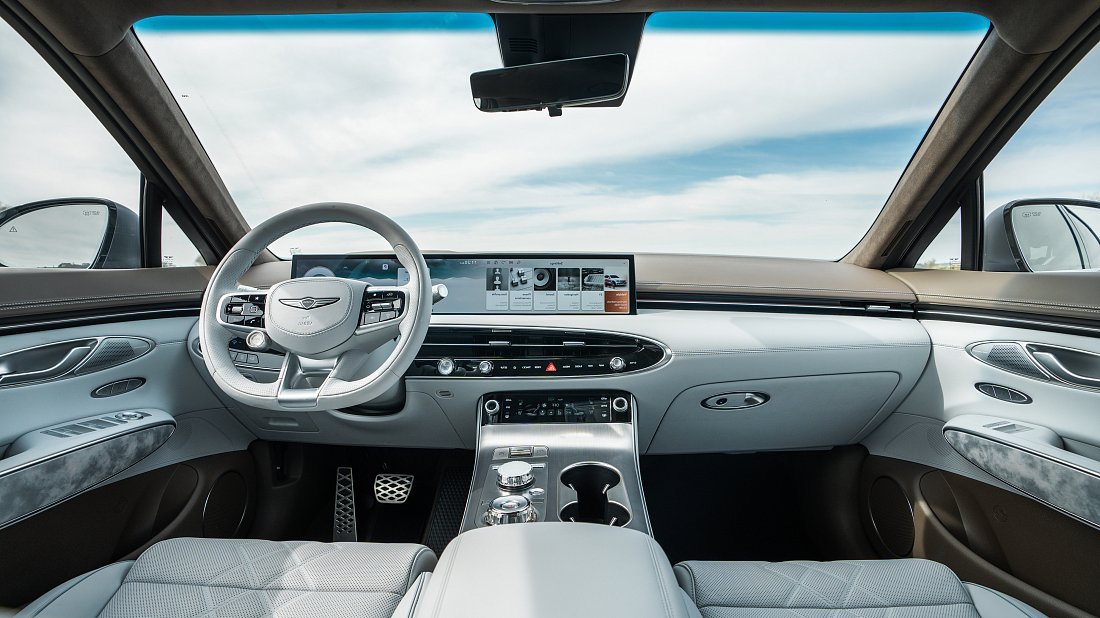 Genesis Electrified GV70 AWD (2025-…) interior photo, front seat, driver seat, dashboard, steering wheel, infotainment, cockpit