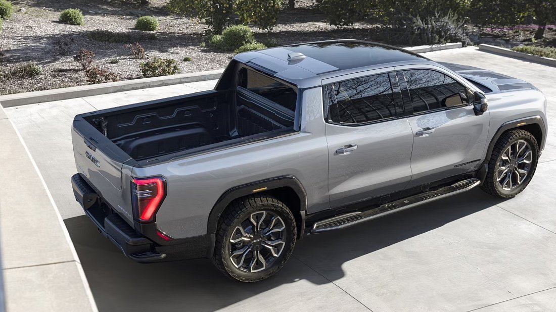 GMC Sierra EV Denali Edition 1 (2024-2025) rear quarter photo, three-quarter view, diagonal, exterior