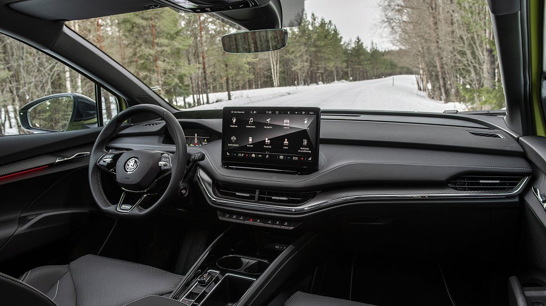 Škoda Enyaq iV RS (2023) interior photo, front seat, driver seat, dashboard, steering wheel, infotainment, cockpit