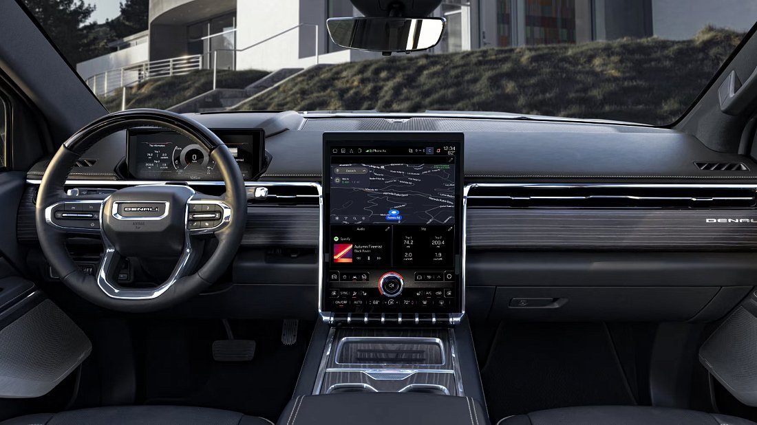 GMC Sierra EV Denali Edition 1 (2024-2025) interior photo, front seat, driver seat, dashboard, steering wheel, infotainment, cockpit