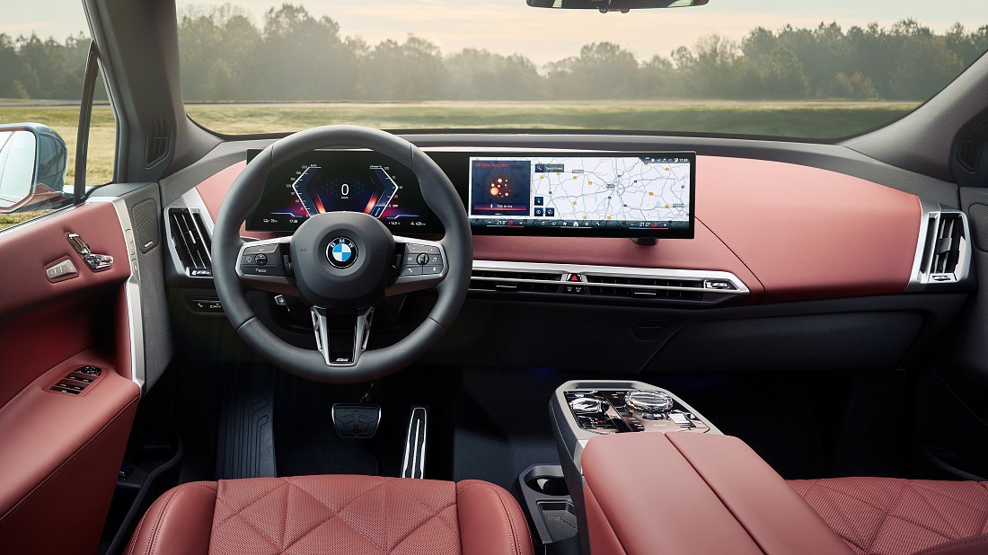 BMW iX xDrive60 (2025-...) interior, front seat, driver seat, dashboard, steering wheel, infotainment, cockpit