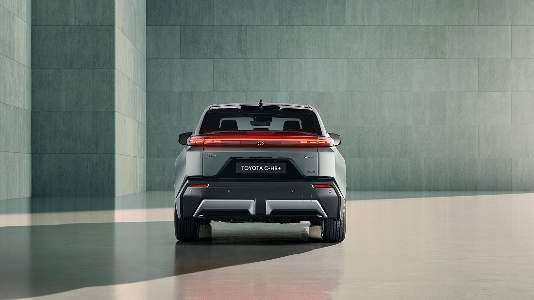 Toyota C-HR+ 77 kWh FWD (2025-…) rear view, taillights, trunk, spoiler, badge, bumper, exterior