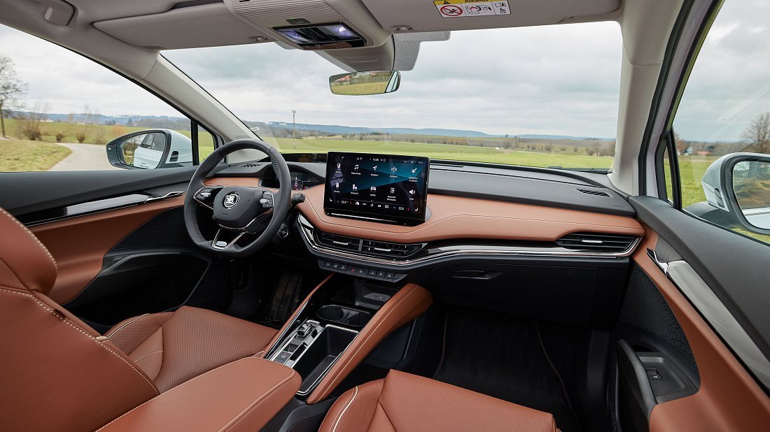 Škoda Enyaq 60 (2023-2024) interior, front seat, driver seat, dashboard, steering wheel, infotainment, cockpit