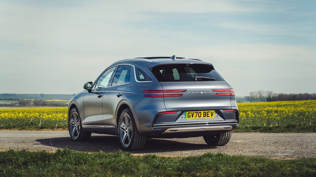 Genesis Electrified GV70 AWD (2025-…) rear quarter photo, three-quarter view, diagonal, exterior
