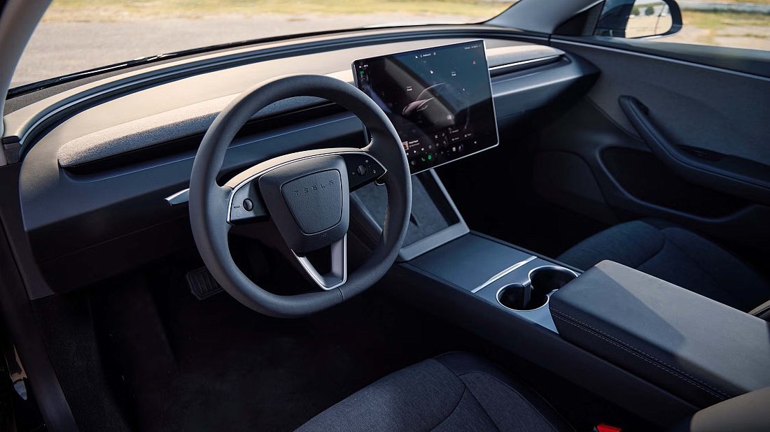 Tesla Model 3 Standard RWD (2025-...) interior photo, front seat, driver seat, dashboard, steering wheel, infotainment, cockpit